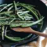 charred green beans on a plate